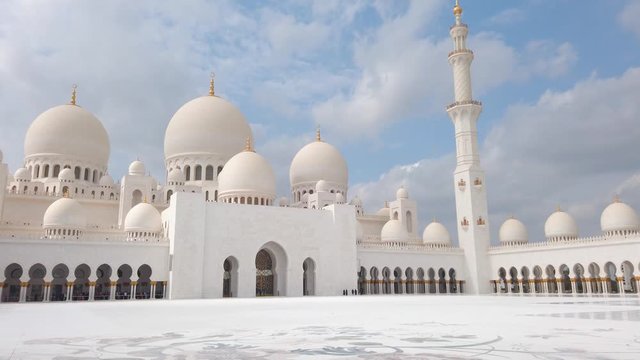 Sheikh Zayed Grand Mosque in Abu Dhabi one of the most famous UAE landmarks on a sunny day