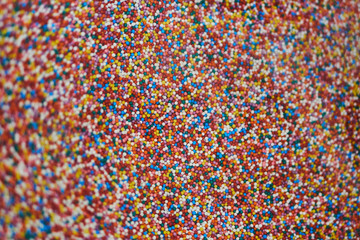 A variety of sweet candies in a store on the counter.