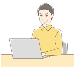 パソコンを操作して笑顔の男性