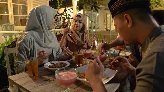 portrait of muslim friend having dinner for break fasting together