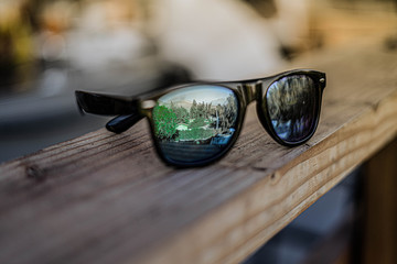 sunglasses on a wooden table