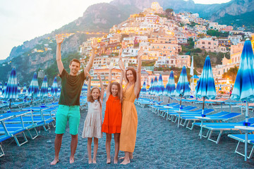 Fototapeta na wymiar Summer holiday in Italy. Young woman in Positano village on the background, Amalfi Coast, Italy