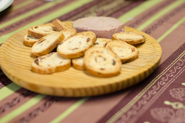 Pate board with raisin buns.