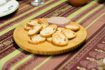 Pate board with raisin buns.
