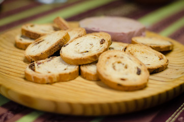 Pate board with raisin buns.