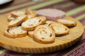 Pate board with raisin buns.