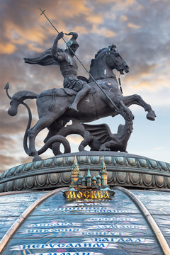 Bronze statue of Saint George and the Dragon at sunset in Moscow Russia on a dome