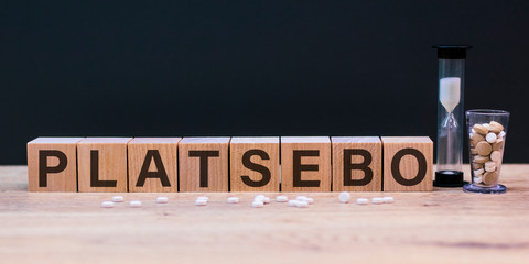 The word platsebo on wooden cubes. Medical concept close-up