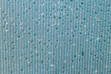 Water drops texture on a plastic surface. Abstract background with rain drops