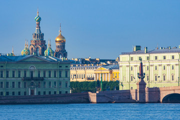 Saint-Petersburg. Russia. Embankment of the Neva river. Rivers Of St. Petersburg. Bridges Of St. Petersburg. Domes of the Savior on blood. Classical architecture. Travel to the cities of Russia.