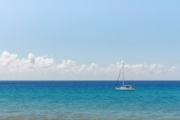 Fototapeta premium Minimalist seascape with turquoise waters and cloudy sky