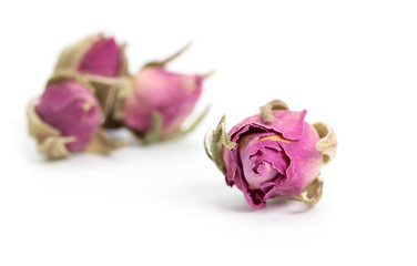 Dried rose flower head isolated on white background