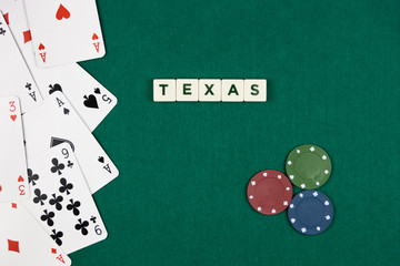 Texas poker concept with cards on the left and colored chips on the right with green background