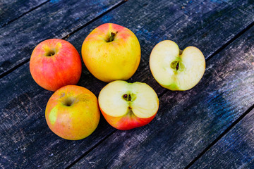 Pile of the ripe apples on wooden table