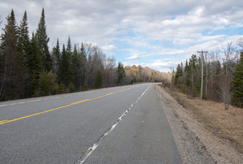 Highway 60 is empty in Algonquin Park due to park closure and  reduced provincial travel during Co-vid pandemic