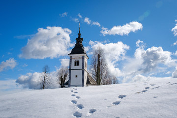 Fototapeta na wymiar Church on the top of Bukov vrh hill in winter