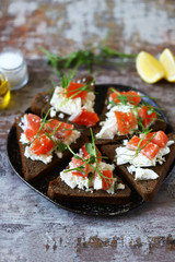 Selective focus. Macro. Healthy toasts with salmon and microgreens.
