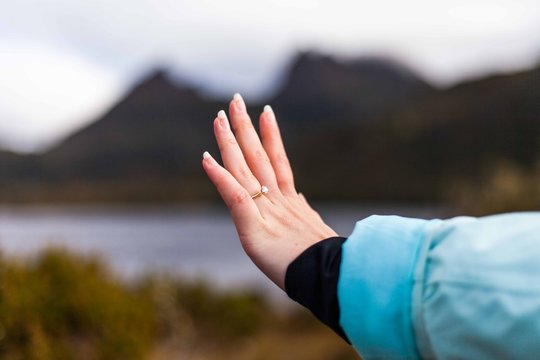 engagement ring with mountain behind dove lake tasmania