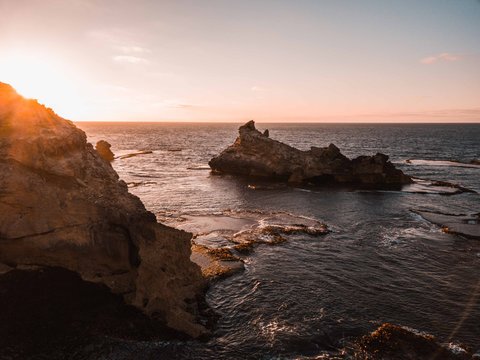 cold sunrise over ocean cliffs
