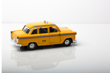 European style yellow taxi in yellow color on white background.