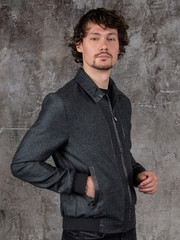 Studio portrait of attractive young man. Young Male Fashion Model Posing In Casual Outfit. 