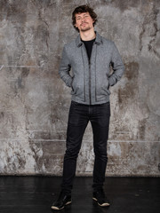 Obraz premium Studio portrait of attractive young man. Young Male Fashion Model Posing In Casual Outfit. 
