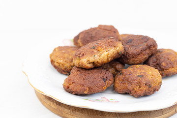 Fried meatballs served on the plate with white background