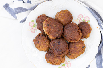 Flatlay above Fried meatballs served on the plate with white background