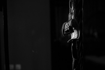 BDSM Leather handcuffs for role-playing games on a black background. Bondage for carnal pleasures....