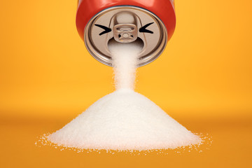 A can of soda simulates a face vomiting refined white sugar. Visual metaphor indicating the high sugar content of soft drinks.