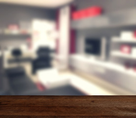 wood table on blur modern living room interior background - can used for display or montage your products