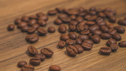 Grains of coffe with wood background