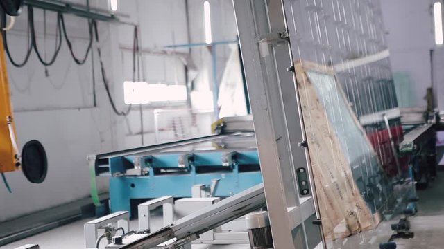 Automatic line in Factory for UPVC windows and doors production. Manufacturing jobs. Factory Work on the production of PVC windows. UPVC window production technology.