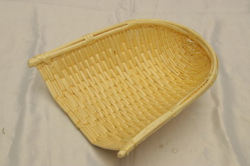 Handwoven wicker bamboo dustpan isolated. Basket art