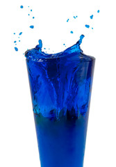 Blue cocktail or water splashes in glass isolated on the white
