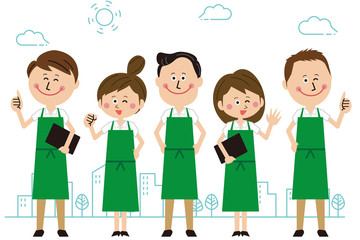 ポップな緑のエプロンをした男女が整列ポーズ　屋外