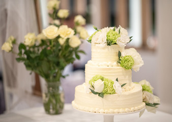wedding cake on table in wedding ceremony