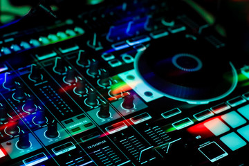 Fototapeta premium All in one Mobile DJ Controller Showing one deck & Mixer Section With Buttons, Sliders & Knobs