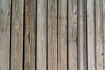 weathered wooden planks of seaside dock for background and texture