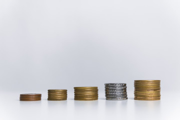 five types of coins stacked in a row