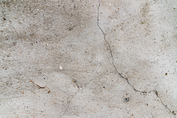 cracked cement wall. light gray