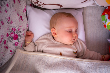 Top view of little cute baby girl sleeping.Newborn's nap time or bedtime. Baby sleep routine and schedule.