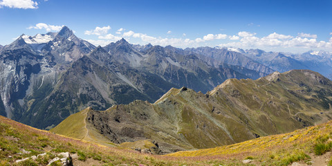 Hiking in Aosta valley, Cogne, Italy. Amazing panorama from lonely place (2900 m) above Tsa Seche col with  Grivola Group in the background on the left.