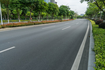 Fototapeta na wymiar curve asphalt road in early morning city