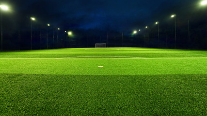 Naklejka na ściany i meble empty soccer field with spot light at night, green football court for futsal