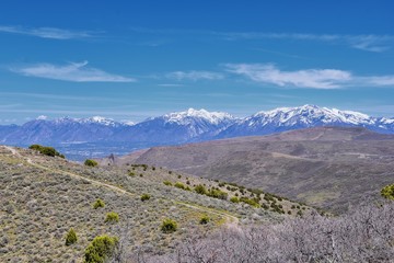 Views of Wasatch Front Rocky Mountains from the Oquirrh Mountains in early spring, Hiking in Yellow Fork trail and Rose Canyon in Great Salt Lake Valley. Utah, United States. USA.