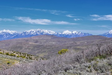 Views of Wasatch Front Rocky Mountains from the Oquirrh Mountains in early spring, Hiking in Yellow Fork trail and Rose Canyon in Great Salt Lake Valley. Utah, United States. USA.