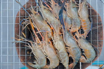 Fresh shrimp grilled bbq seafood on charcoal stove