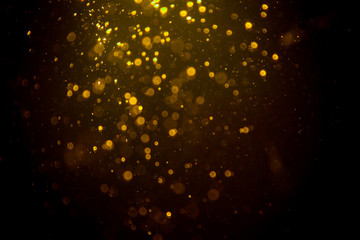 Obraz na płótnie Canvas Dark Abstract Gold bokeh sparkle