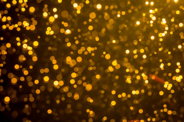Golden blur glitter  lights abstract bokeh for Merry Christmas and New Year